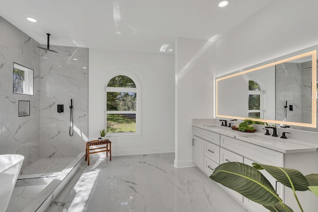 bathroom featuring vanity and tiled shower