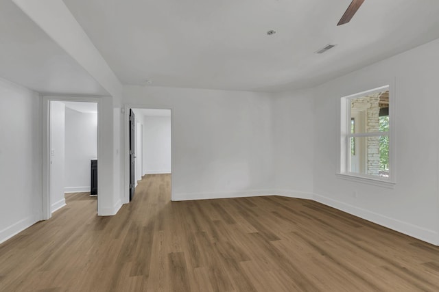 spare room featuring ceiling fan and hardwood / wood-style flooring