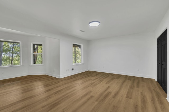 empty room featuring hardwood / wood-style floors