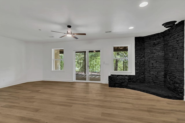 empty room featuring ceiling fan and light hardwood / wood-style flooring