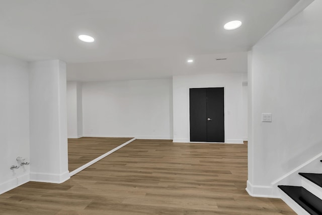 spare room featuring hardwood / wood-style floors