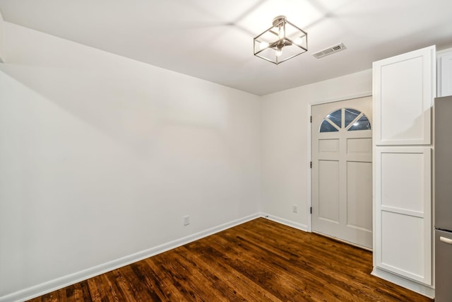 foyer entrance with dark wood-type flooring