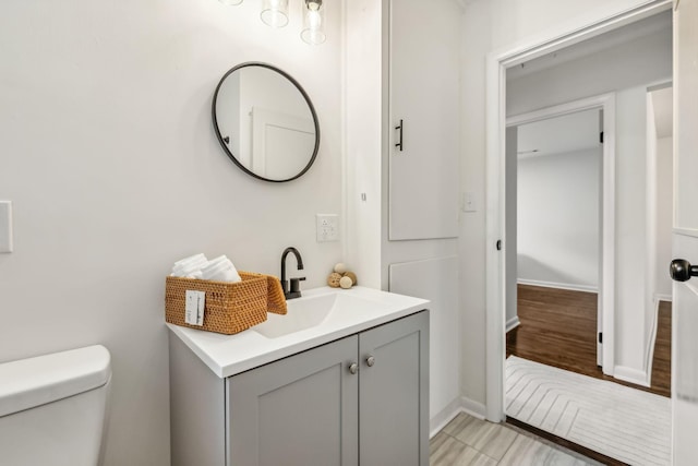 bathroom with vanity and toilet