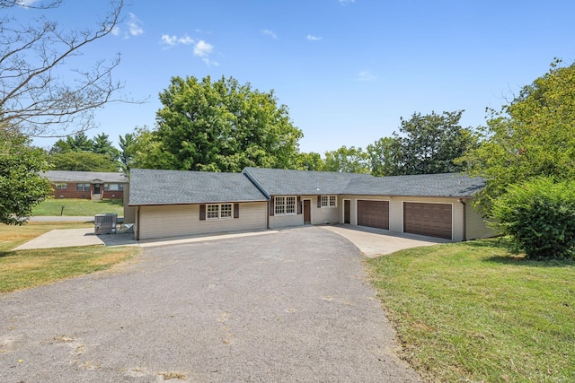 single story home with a front lawn and a garage