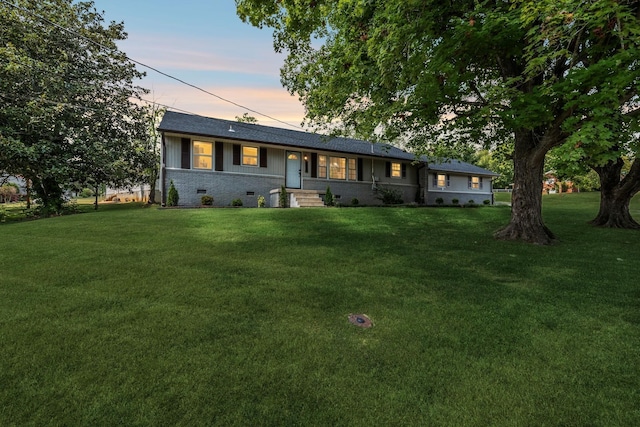 ranch-style house with a lawn