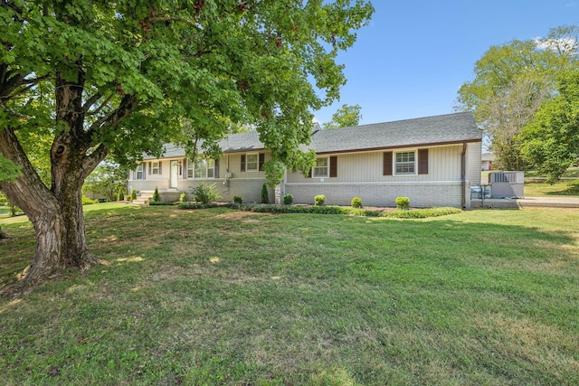 ranch-style home with a front yard