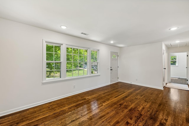 spare room with dark hardwood / wood-style floors