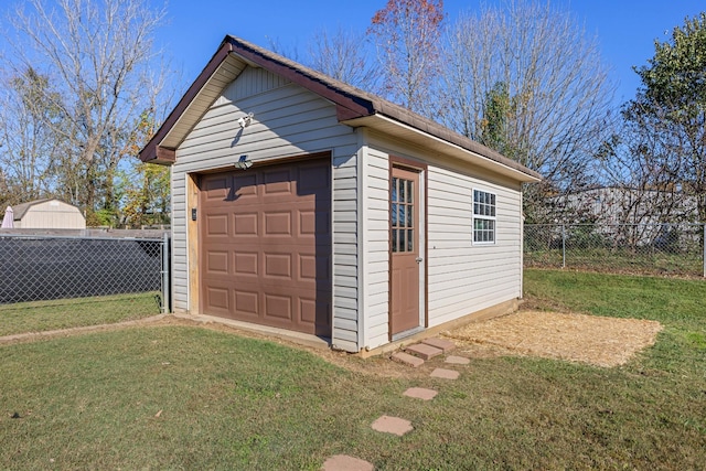 garage featuring a yard