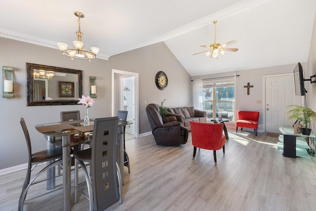 dining space featuring hardwood / wood-style flooring, ceiling fan with notable chandelier, and lofted ceiling with beams