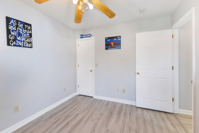 unfurnished bedroom with light wood-type flooring and ceiling fan