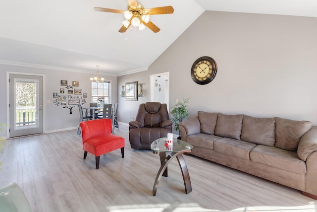 living room featuring high vaulted ceiling, light hardwood / wood-style floors, and ceiling fan with notable chandelier