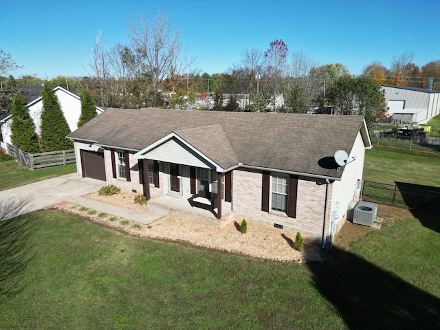 view of front of property featuring a porch, a garage, a front lawn, and central air condition unit