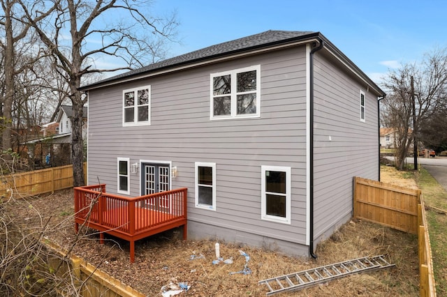 rear view of property with french doors and a wooden deck