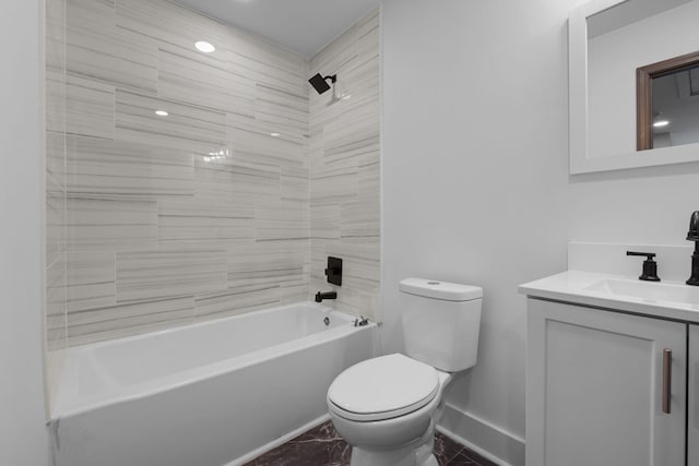 full bathroom with vanity, toilet, and tiled shower / bath