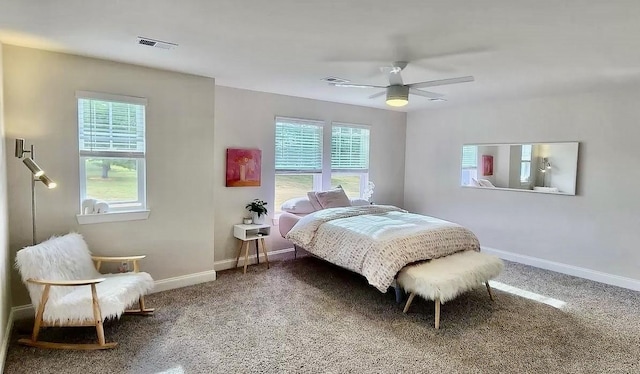 bedroom featuring ceiling fan and carpet