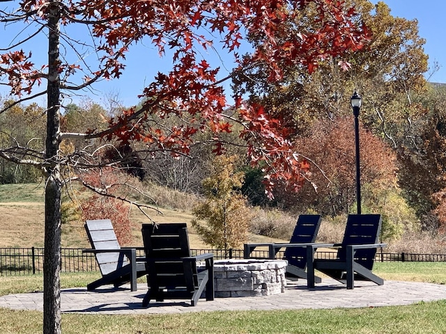 view of patio / terrace featuring an outdoor fire pit