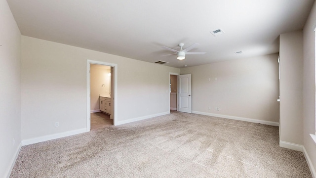 unfurnished room featuring ceiling fan and light colored carpet