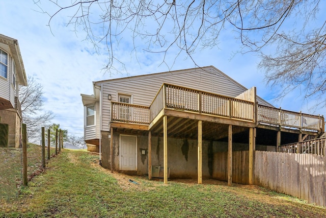 rear view of house with a wooden deck