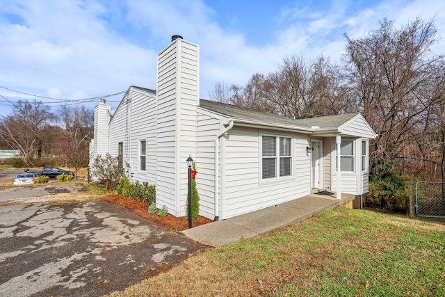 view of home's exterior featuring a yard