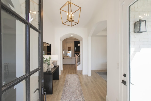 entrance foyer featuring a chandelier and light hardwood / wood-style flooring