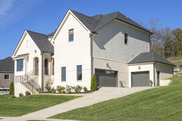 view of front facade with a front lawn and a garage