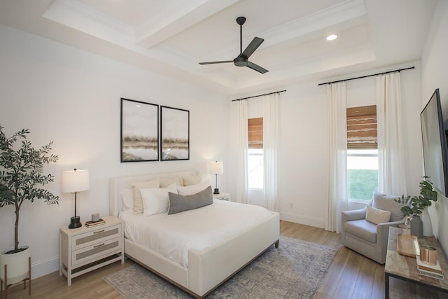 bedroom with beam ceiling, ceiling fan, and light wood-type flooring