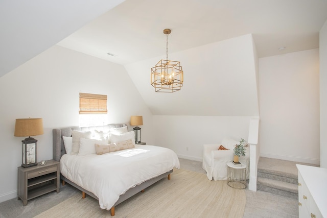 bedroom featuring a chandelier, light colored carpet, and vaulted ceiling