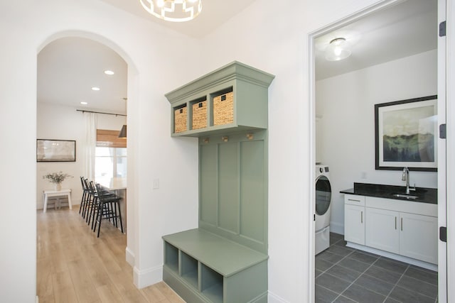 mudroom featuring washer / clothes dryer and sink