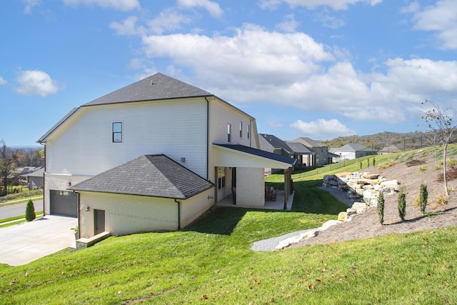 view of side of property with a yard