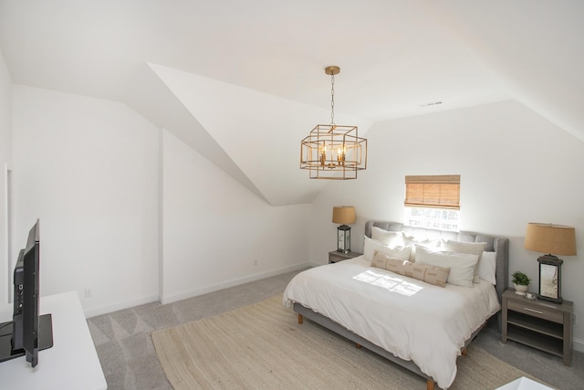 bedroom featuring carpet flooring, an inviting chandelier, and lofted ceiling