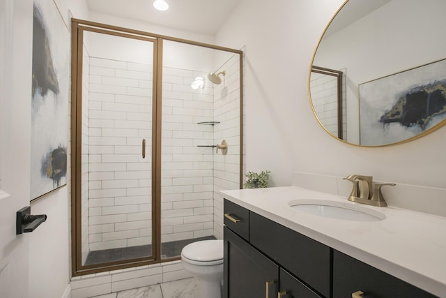 bathroom featuring toilet, an enclosed shower, and vanity