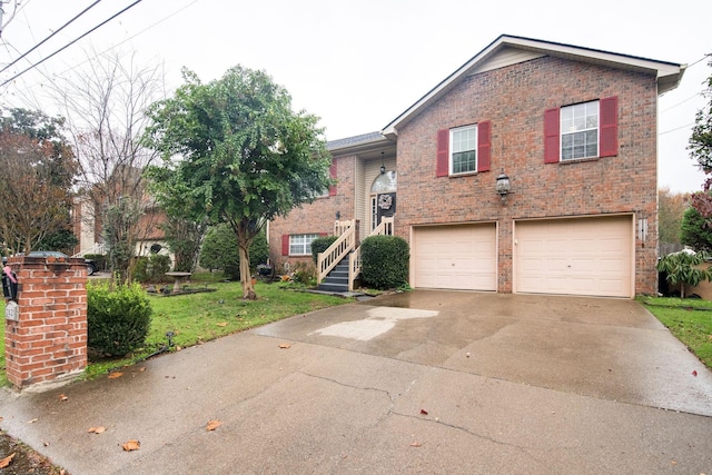 view of front of house with a front yard and a garage