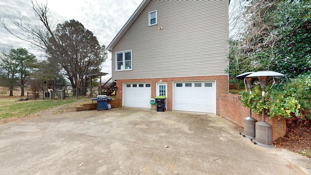 view of side of property featuring a garage