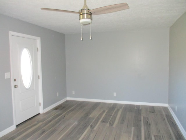 foyer entrance with dark wood-type flooring