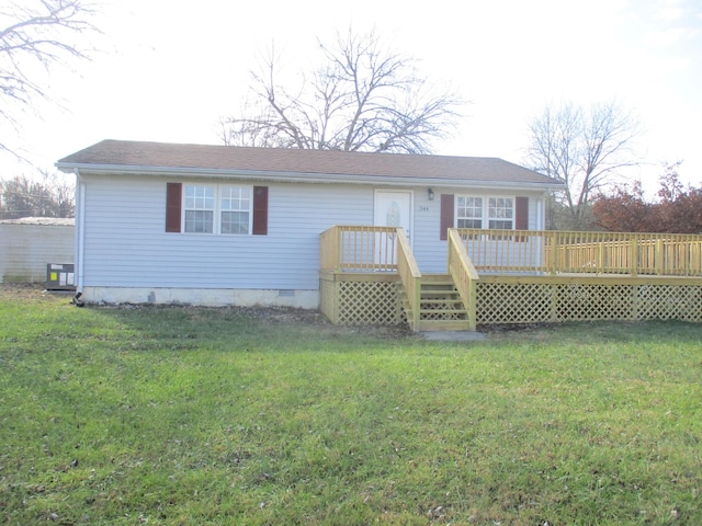 back of property featuring a yard and a deck