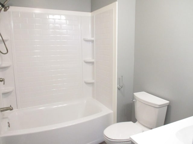 bathroom with toilet and shower / washtub combination