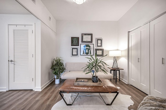 sitting room featuring dark hardwood / wood-style floors