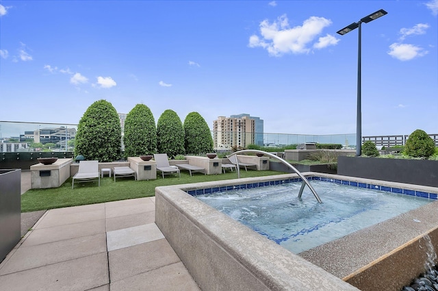 view of swimming pool featuring an in ground hot tub