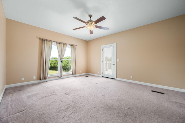 carpeted empty room with ceiling fan