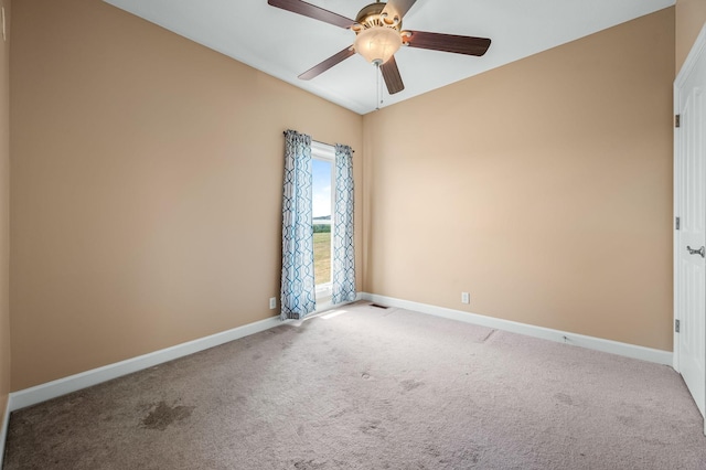 empty room with light carpet and ceiling fan