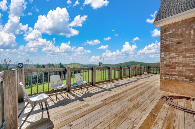 wooden terrace with a mountain view