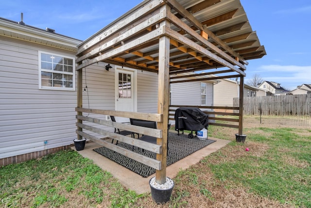 doorway to property featuring a lawn