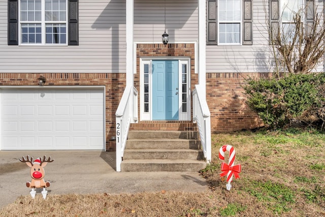 doorway to property featuring a garage