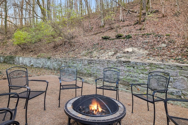 view of patio with a fire pit