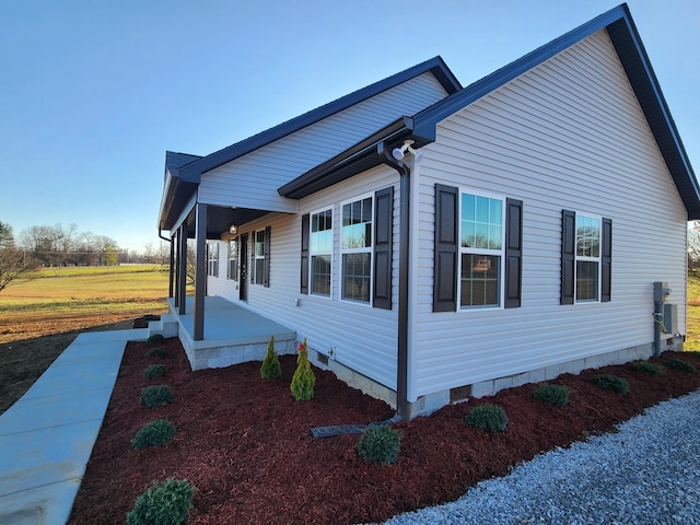 view of side of home with a porch