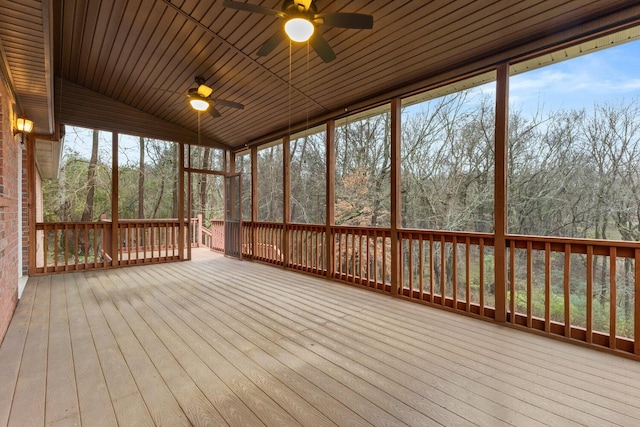 unfurnished sunroom with ceiling fan and wood ceiling