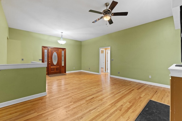 entrance foyer featuring light hardwood / wood-style floors and ceiling fan