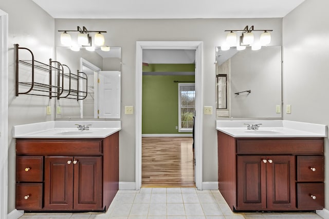 bathroom featuring tile patterned flooring and vanity