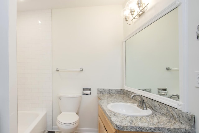 full bathroom with vanity, tiled shower / bath combo, and toilet