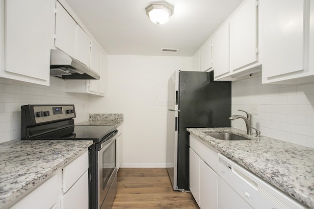 kitchen with white cabinets, hardwood / wood-style flooring, sink, and appliances with stainless steel finishes